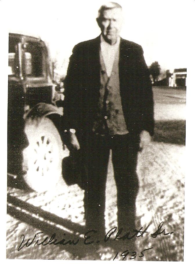 Dr. William Erastus Platt standing beside a car, 1935